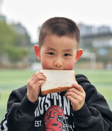 boy eating bread