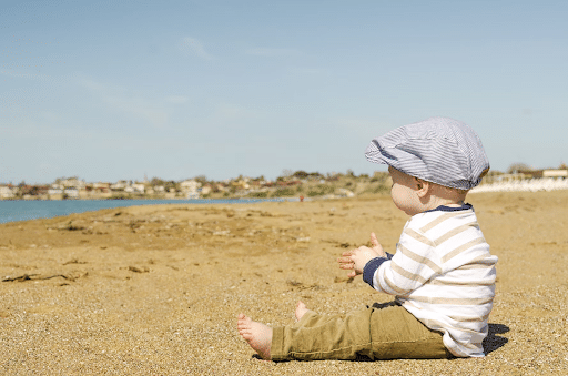 boy playing in sand