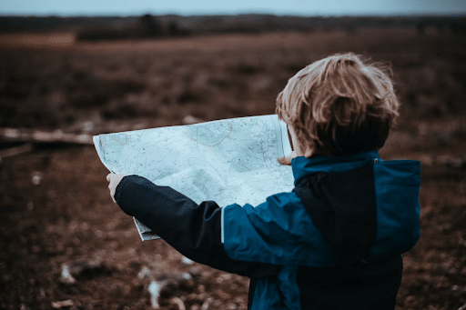 boy reading map