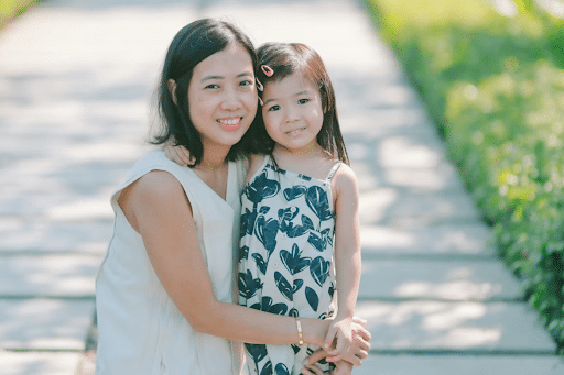 mom and girl hugging