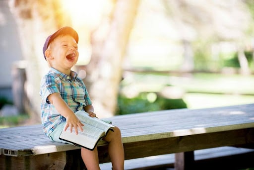 neurodivergent boy laughing